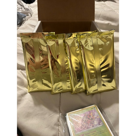 Pokemon 4 Gold Packs 25 Official TCG Cards Assorted Envelopes Hidden  Treasures - crrs.pl